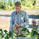Dale Cocklin of Two Peas in a Pod Farm sells an abundance of root vegetables like beets, kohlrabi, carrots and more at his stand at the Farmers Fresh Market on Tuesday, Aug. 28 2018 at the Kenai Peninsula Food Bank, near Soldotna, Alaska. (Photo by Victoria Petersen/Peninsula Clarion)