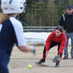 Kenai Centrals Leinani Rapoza fields a ground ball from Soldotnas Lillian Gomez Thursday, April 25, 2019, at the Soldotna Softball Fields. (Photo by Joey Klecka/Peninsula Clarion)