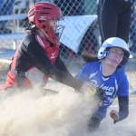 Palmers Zoe Patton-Meyer slides under the tag of Kenai Central catcher Kylen Lakshas on Friday, April 26, 2019, at Steve Shearer Memorial Ball Park in Kenai, Alaska. (Photo by Jeff Helminiak/Peninsula Clarion)