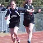 Nikiski sophomore Bailey Epperheimer (right) hands off to her sister Sidney Epperheimer Saturday afternoon in the girls 400-meter relay at the SoHi Region III Preview Invite at Justin Maile Field in Soldotna. (Photo by Joey Klecka/Peninsula Clarion)