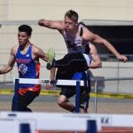 Kenai Central senior Jarett Wilson tackles the boys 300-meter hurdles Saturday afternoon at the SoHi Region III Preview Invite at Justin Maile Field in Soldotna. (Photo by Joey Klecka/Peninsula Clarion)
