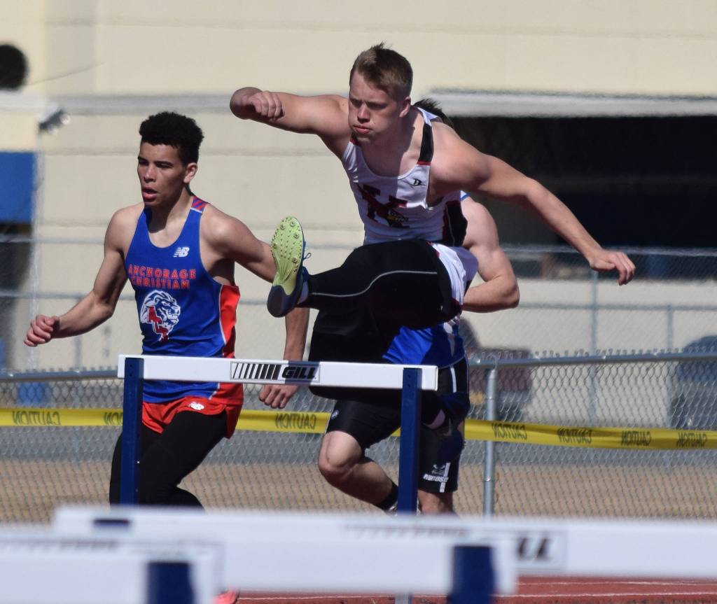 Kenai Central senior Jarett Wilson tackles the boys 300-meter hurdles Saturday afternoon at the SoHi Region III Preview Invite at Justin Maile Field in Soldotna. (Photo by Joey Klecka/Peninsula Clarion)