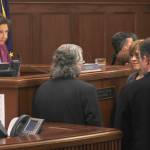 Senate President Cathy Giessel, left, listens to Senate leaders on the floor at the Alaska State Capitol on Wednesday, May 1, 2019. (Alex McCarthy | Juneau Empire)