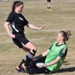 Nikiskis Tawnisha Freeman (left) collides with Seward goalkeeper Eva Ballard in a race to the ball Friday afternoon in a Peninsula Conference contest at Nikiski High School. (Photo by Joey Klecka/Peninsula Clarion)