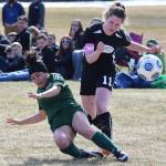 Sewards Naomi Ifflander attempts to knock the ball from Nikiskis Jordyn Stock (11) Friday afternoon in a Peninsula Conference contest at Nikiski High School. (Photo by Joey Klecka/Peninsula Clarion)