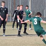 Sewards Samuel Koster fires a free kick towards a wall of Nikiski defenders (L to R, Koleman McCaughey, Cody Handley and Jace Kornstad) Friday afternoon in a Peninsula Conference contest at Nikiski High School. (Photo by Joey Klecka/Peninsula Clarion)