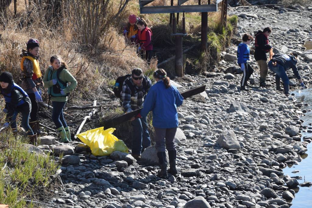 Students from Redoubt Elementary pick up trash along the river during the 6th Annual Kids Kenai River Spring Cleanup at Swiftwater Park in Soldotna, Alaska on May 3, 2019. (Photo by Brian Mazurek/Peninsula Clarion)