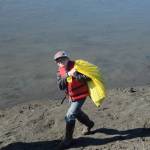 A student from Redoubt Elementary carries his haul back to the pile during the 6th Annual Kids Kenai River Spring Cleanup at Swiftwater Park in Soldotna, Alaska on May 3, 2019. (Photo by Brian Mazurek/Peninsula Clarion)