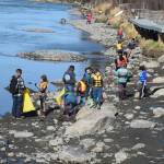 Students from Redoubt Elementary pick up trash along the river during the 6th Annual Kids Kenai River Spring Cleanup at Swiftwater Park in Soldotna, Alaska on May 3, 2019. (Photo by Brian Mazurek/Peninsula Clarion)