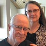 Mike Gordon, left, and Shelli Gordon, right, pose with a copy of Mike Gordons memoir, Learning the Ropes. (Photo by Joe Columbus)