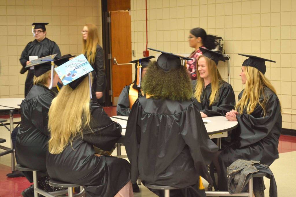 A group of nursing graduates from Kenai Peninsula Colleges Kenai River Campus get ready to walk the stage and receive their degrees on Thursday, May 9, 2019, at Kenai Central High School in Kenai, Alaska. (Photo by Victoria Petersen/Peninsula Clarion)