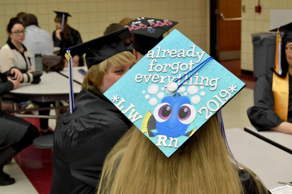A group of nursing graduates from Kenai Peninsula Colleges Kenai River Campus get ready to walk the stage and receive their degrees on Thursday, May 9, 2019, at Kenai Central High School in Kenai, Alaska. (Photo by Victoria Petersen/Peninsula Clarion)