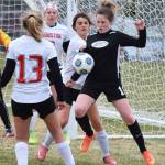 Nikiskis Jordyn Stock (right) attempts to corral the ball in front of the Houston goal Friday, May 10, 2019, in a nonconference game in Nikiski, Alaska. (Photo by Joey Klecka/Peninsula Clarion)