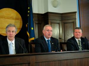 Alaska House Speaker Bryce Edgmon, center, speaks to reporters after the House failed to accept a Senate rewrite of a crime bill, Tuesday, May 14, 2019, in Juneau, Alaska. Also pictured are state Reps. Matt Claman, left, and Chuck Kopp. (AP Photo/Becky Bohrer)