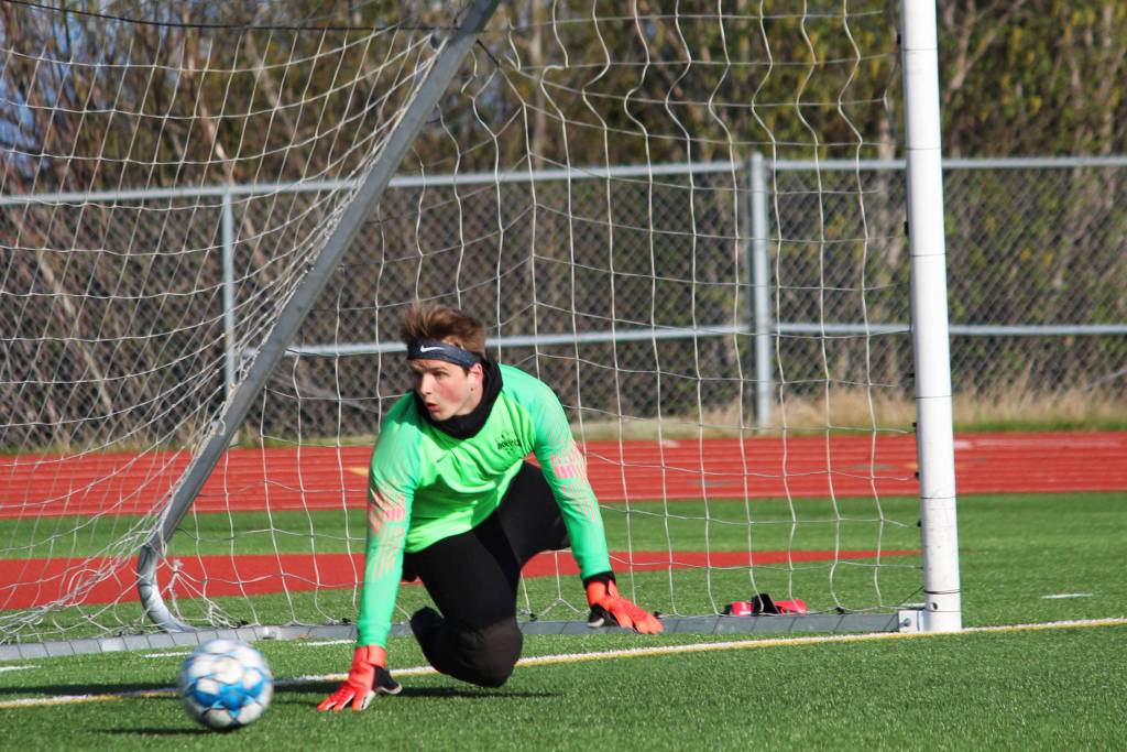 Nikiski goalkeeper Mike Eiter defends against a penalty kick from Seward during the first boys game of the Peninsula Conference Soccer Tournament on Thursday, May 16, 2019 at Homer High School in Homer, Alaska. (Photo by Megan Pacer/Homer News)