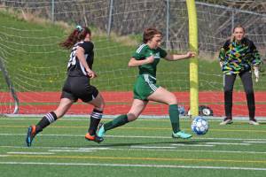 Sewards Mikya Wallace steals the ball from Nikiskis Tawnisha Freeman before she can make a shot during the first girls game of the Peninsula Conference Soccer Tournament on Thursday, May 16, 2019 at Homer High School in Homer, Alaska. (Photo by Megan Pacer/Homer News)