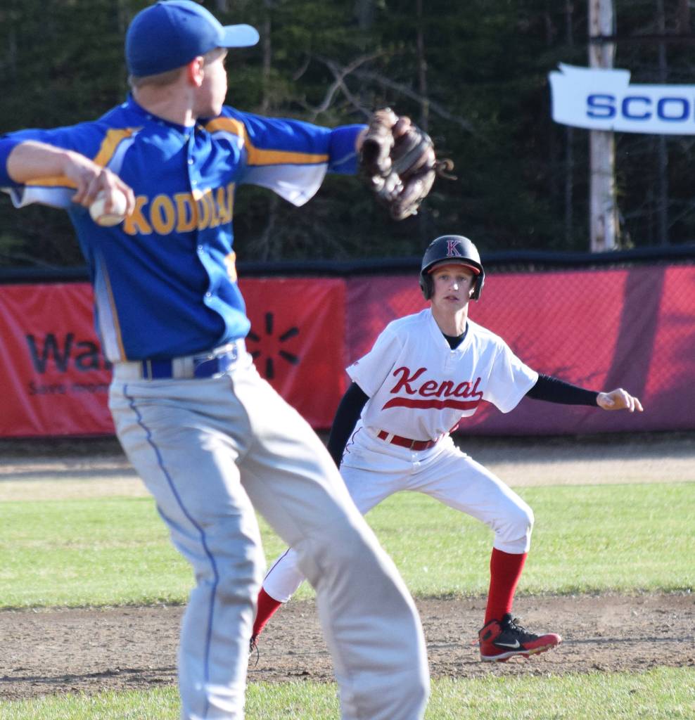 Kenais Jaryn Zoda attempts to steal a base on Kodiak pitcher Joel Wiersum Thursday, May 16, 2019, at the Kenai Little League Fields in Kenai, Alaska. (Photo by Joey Klecka/Peninsula Clarion)