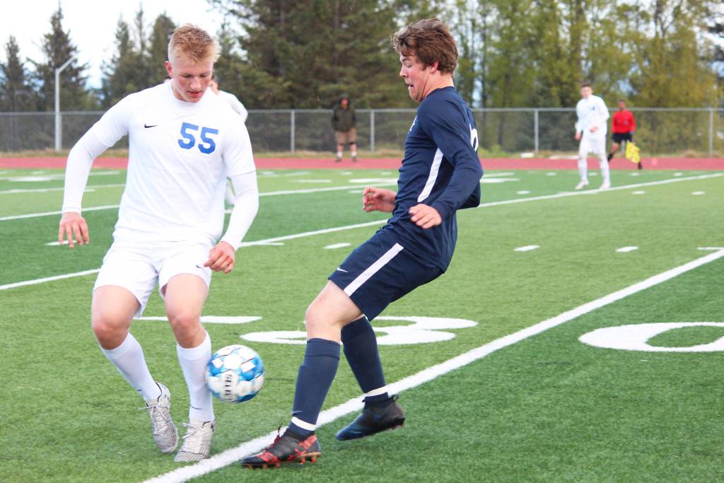 Homers Phinny Weston (right) battles for the ball with Soldotnas Hudson Metcalf during the semi-final game of the Peninsula Conference Soccer Tournament on Friday, May 17, 2019 at Homer High School in Homer, Alaska. (Photo by Megan Pacer/Homer News)