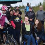 Participants in the annual Special Olympics Torch Run smile for a photo outside the Soldotna Regional Sports Complex in Soldotna Alaska on May 18, 2019. (Photo by Brian Mazurek/Peninsula Clarion)