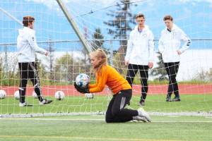 Homers Paige Jones saves a penalty kick from Soldotna during the girls championship game of the Peninsula Conference Soccer Tournament on Saturday, May 18, 2019 at Homer High School in Homer, Alaska. (Photo by Megan Pacer/Homer News)