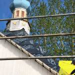 John Wachtel, a former National Parks Service employee, places new cedar shingles on the roof of the Saint Nicholas Memorial Chapel as part of new restorative efforts, on Tuesday, May 21, 2019, in Old Town Kenai, Alaska. (Photo by Victoria Petersen/Peninsula Clarion)
