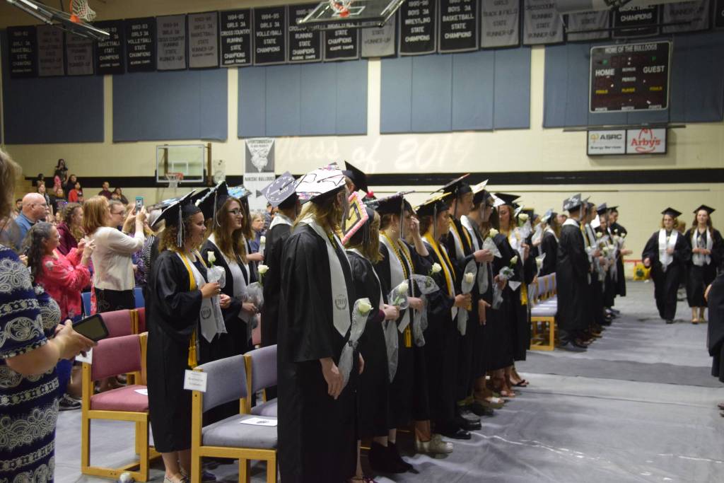 Graduates take their seats during the 2019 Nikiski High School graduation in Nikiski, Alaska on May 20, 2019. (Photo by Brian Mazurek/Peninsula Clarion)