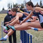 Soldotnas Kylie Ness (left) and teammate Sophie Thomas lead the pack over the first hurdle in the Class 3A girls 100-meter hurdles Saturday, May 18, 2019, at the Region III Track and Field Championships in Soldotna, Alaska. (Photo by Joey Klecka/Peninsula Clarion)