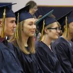 From left to right, the four 2019 Ninilchik School graduates: Garrett Koch, Isabella Koch, Tala Hadro and Jacob Shell listen during their graduation ceremony Tuesday, May 21, 2019 at Ninilchik School in Ninilchik, Alaska. (Photo by Megan Pacer/Homer News)