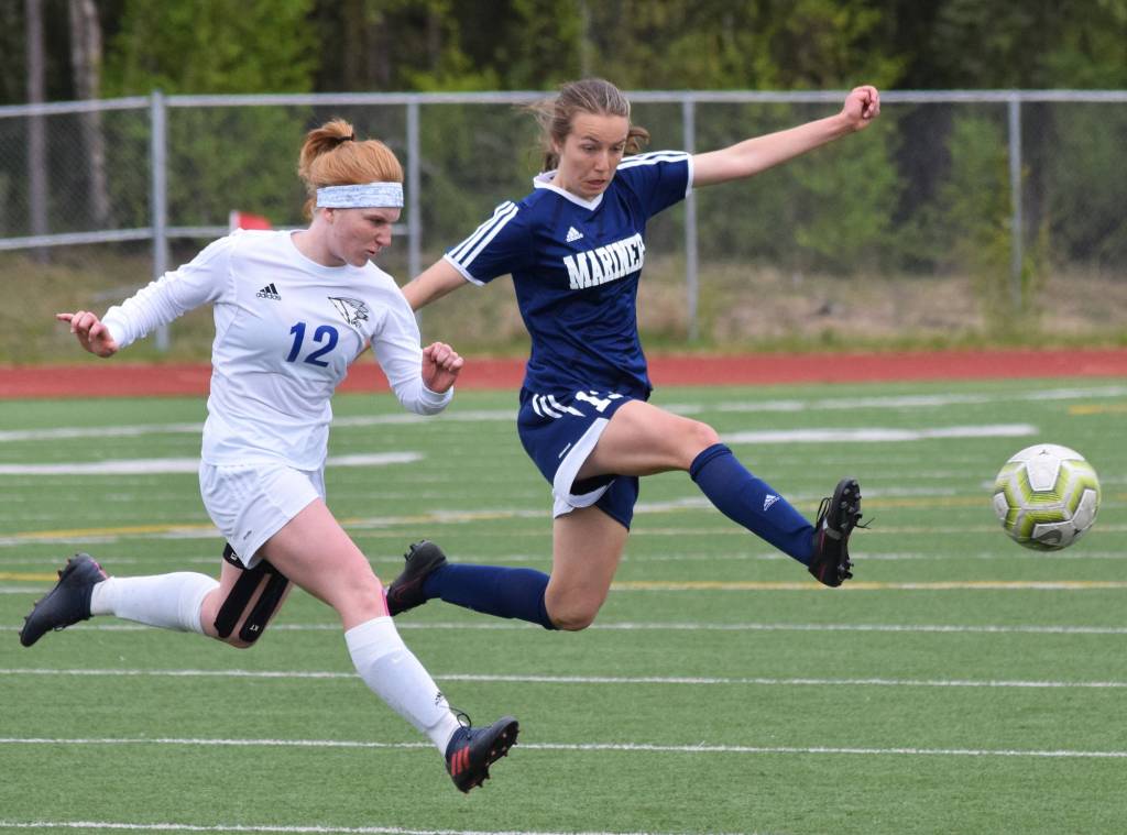 Thunder Mountains Emily Heaton (left) and Homers Kappa Reutov battle for the ball Thursday, May 23, 2019, at the Div. II state soccer championships in Eagle River. (Photo by Joey Klecka/Peninsula Clarion)