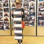 Sarina Wilkinson stands with her current Microsoft Specialist certifications, Wilkinson is currently working toward her last one on Tuesday, May 21, 2019, at Soldotna Prep School in Soldotna, Alaska.