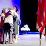 Graduate Emerald Miller receives her high school diploma from her parents at the Kenai Peninsula Borough School District Connections home-school program graduation ceremony at Soldotna High School on Thursday. (Photo by Victoria Petersen/Peninsula Clarion)