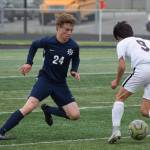 Homers Austin Shafford (left) defends a move by Ketchikans Apollo Jasper Thursday, May 23, 2019, at the Div. II state soccer championships at West High School. (Photo by Joey Klecka/Peninsula Clarion)
