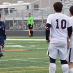 Homers Phinny Weston delivers a free kick against a line of Ketchikan defenders Thursday, May 23, 2019, at the Div. II state soccer championships at West High School. (Photo by Joey Klecka/Peninsula Clarion)