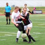Kenais Rileigh Pace (left) and Juneaus Kyla Bentz (right) battle for the ball in a Friday, May 24, 2019 semifinal game during the Division II state soccer championship tournament at Service High School in Anchorage, Alaska. (Photo by Megan Pacer/Homer News)