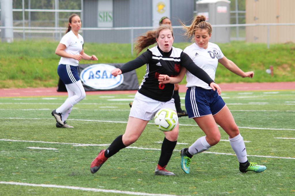 Juneaus Eva Goering (left) and Soldotnas Ryann Cannava battle for the ball during the final game of the Division II state soccer championships Saturday, May 25, 2019 at Service High School in Anchorage, Alaska. (Photo by Megan Pacer/Homer News)