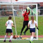 Juneau goalkeeper Shaylin Cesar grabs a ball out of the air on a shot from Soldotnas team during the final game of the Division II state soccer championships Saturday, May 25, 2019 at Service High School in Anchorage, Alaska. (Photo by Megan Pacer/Homer News)
