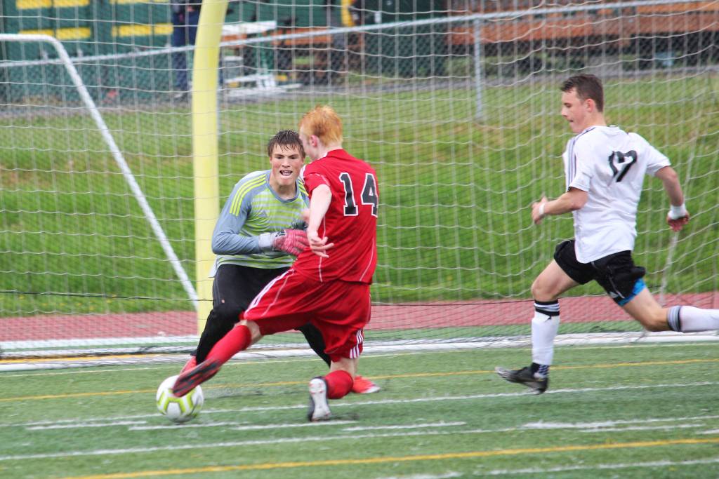 Kenai goalkeeper Braedon Pitsch prepares for a shot from Juneaus Kannon Goetz during the final game of the Division II state soccer championship tournament Saturday, May 25, 2019 at Service High School in Anchorage, Alaska. (Photo by Megan Pacer/Homer News)