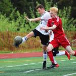 Kenai defender Travis Verkuilen clears the ball while under pressure from Juneaus Kannon Goetz during the champioship match of the Division II state soccer tournament Saturday, May 25, 2019 at Service High School in Anchorage, Alaska. (Photo by Megan Pacer/Homer News)