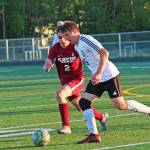 Ketchikans Jake Taylor (left) and Kenais Tucker Vann race to the ball during a Friday, May 24, 2019 semifinal match in the Division II state soccer championships at West Anchorage High School in Anchorage, Alaska. (Photo by Megan Pacer/Homer News)