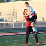 Braedon Pitsch (left) and Travis Verkuilen celebrate their win over Ketchikan in a Friday, May 24, 2019 semifinal match during the Division II state soccer championships at West Anchorage High School in Anchorage, Alaska. (Photo by Megan Pacer/Homer News)