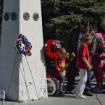 Families were invited to place flowers and wreaths in remembrance of fallen service members at Kenais Memorial Day ceremony on Monday, May 27, 2019, at Leif Hansen Memorial Park in Kenai, Alaska. (Photo by Victoria Petersen/Peninsula Clarion)                                Families were invited to place flowers and wreaths in remembrance of fallen service members at Kenais Memorial Day ceremony on Monday, May 27, 2019, at Leif Hansen Memorial Park in Kenai, Alaska. (Photo by Victoria Petersen/Peninsula Clarion)