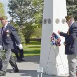 Families were invited to place flowers and wreaths in remembrance of fallen service members at Kenais Memorial Day ceremony on Monday, May 27, 2019, at Leif Hansen Memorial Park in Kenai, Alaska. (Photo by Victoria Petersen/Peninsula Clarion)