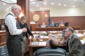 From left, Alaska Sens. Bert Stedman, Mia Costello, Lyman Hoffman and Peter Micciche speak during a break on the Senate floor on Tuesday, June 4, 2019, in Juneau, Alaska. The Senate on Tuesday failed to pass a bill that would have paid a full dividend from Alaskas oil-wealth fund, the Alaska Permanent Fund, this year. (AP Photo/Becky Bohrer)