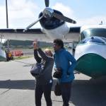 Janneth Martos, left, and Bethany Martos, right, take a selfie in front of Tim Martins 1942 Grumman G-44 Widgeon at the 19th annual Kenai Peninsula Air Fair in Kenai, Alaska on June 8, 2019. Janneth and Bethany are visiting Alaska from Mexico and Spain, respectively. Martin has attended the Air Fair for 5 years and flies down from Anchorage every year to participate in the Poker Run, where pilots are tasked with stopping at several airports around the peninsula to pick up tickets and potentially win prizes. (Photo by Brian Mazurek/Peninsula Clarion)