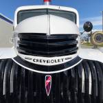 A 1941 Chevrolet 1 1/2 ton firetruck sits outside the Kenai Fine Art Center Thursday, June 6, 2019, during the opening reception to the June exhibit Historic Buildings of Kenai. (Photo by Joey Klecka/Peninsula Clarion)