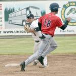 Oilers second baseman Ethan Patrick turns a double play in front of Brandon Cody of the Chugiak-Eagle River Chinooks on Friday, June 15, 2019, at Coral Seymour Memorial Park in Kenai, Alaska. (Photo by Jeff Helminiak/Peninsula Clarion)