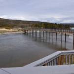 This undated photo provided by the National Park Service shows a new bridge over the Brooks River at Katmai National Park and Preserve in Alaska. The National Park Service has completed a project to relieve an Alaska traffic jam. A new elevated bridge and boardwalk across the Brooks River in Katmai National Park and Preserve is expected to halt heart-stopping encounters between human pedestrians and brown bears both using the old bridge. (Barbara Lutes/National Park Service via AP)