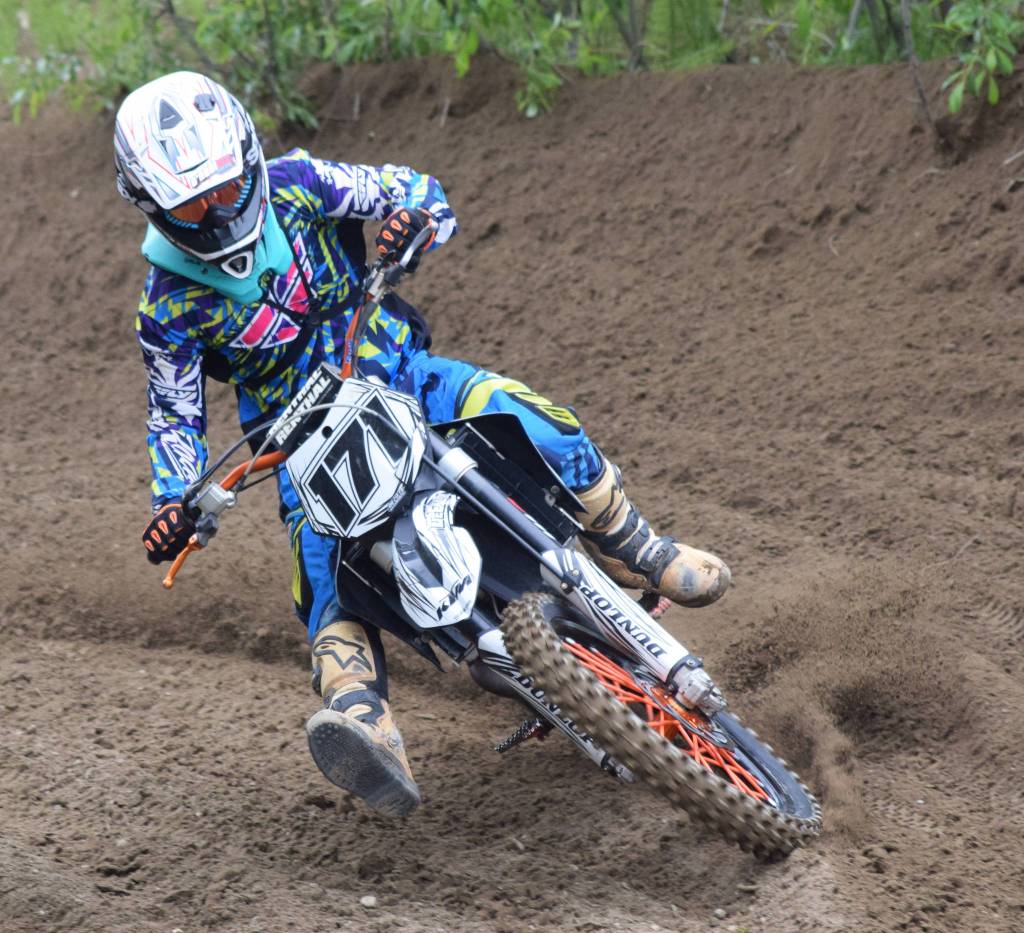 Clarence Martino rips around a corner Saturday, June 15, 2019, at the Alaska State Motocross Championships at Twin City Raceways motocross track in Kenai, Alaska. (Photo by Joey Klecka/Peninsula Clarion)