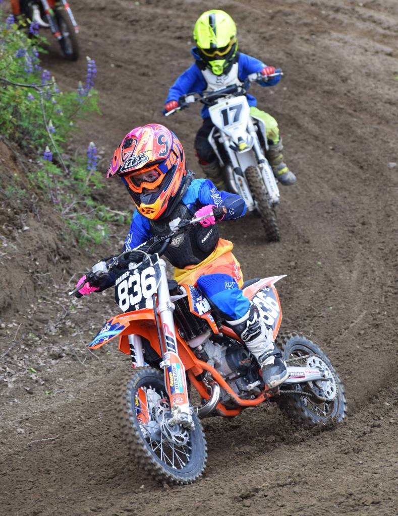Draiden Mullican (836) leads a group of riders in the 65cc class Saturday, June 15, 2019, at the Alaska State Motocross Championships at Twin City Raceways motocross track in Kenai, Alaska. (Photo by Joey Klecka/Peninsula Clarion)