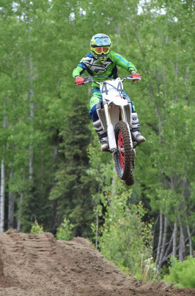 Robby Schachle flies through the air Saturday, June 15, 2019, at the Alaska State Motocross Championships at Twin City Raceways motocross track in Kenai, Alaska. (Photo by Joey Klecka/Peninsula Clarion)